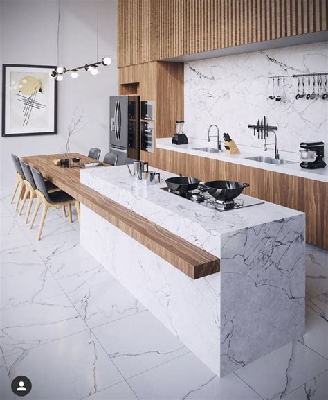 A Modern Kitchen With Marble Counter Tops And Wooden Cabinetry Along