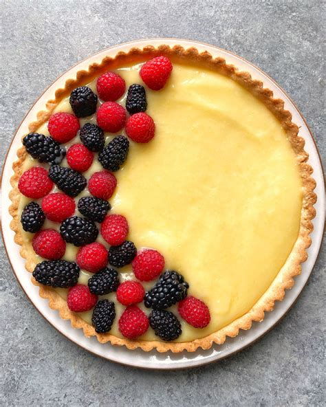 Lemon Curd Tart With Vanilla Sablé Crust And Fresh Berries On The