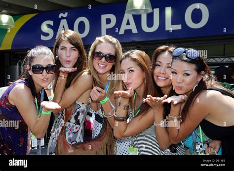 Several Girls Pose Before The Formula One Grand Prix Of Brazil At