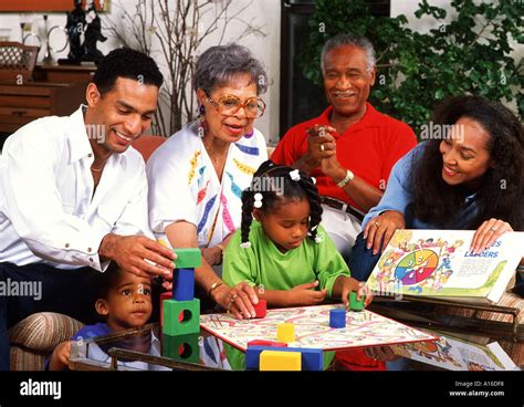 African American family playing board games together Stock Photo - Alamy