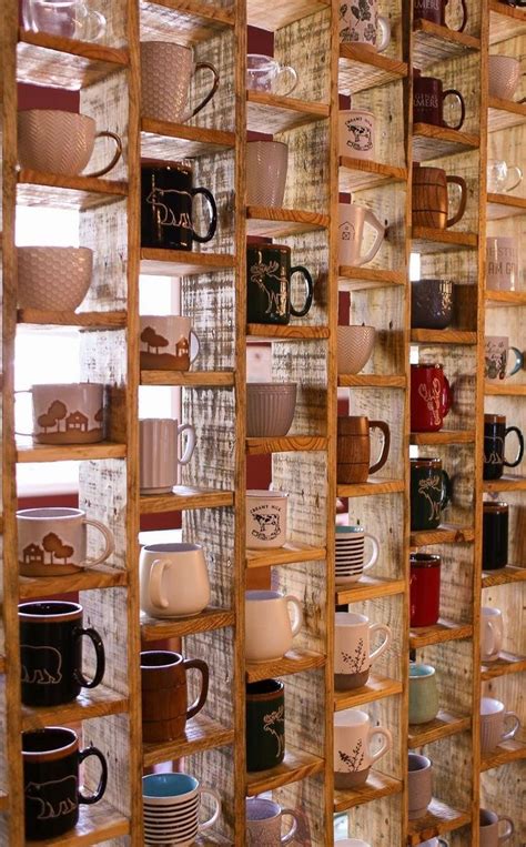 A Display Case Filled With Lots Of Different Types Of Coffee Mugs And