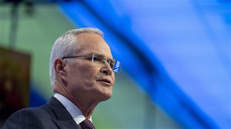 🔒 Exxon Mobil's CEO Darren Woods leads defiant ESG stance