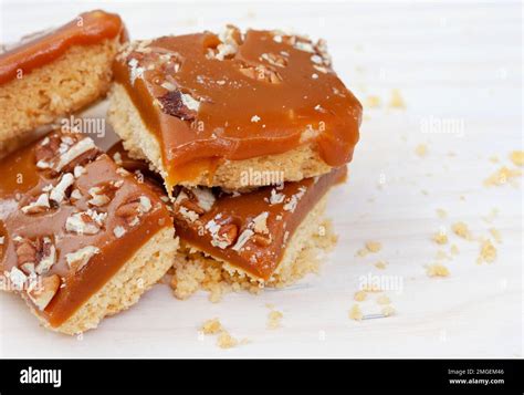 Decadent Shortbread Squares With Salted Caramel And Pecan Nut Topping