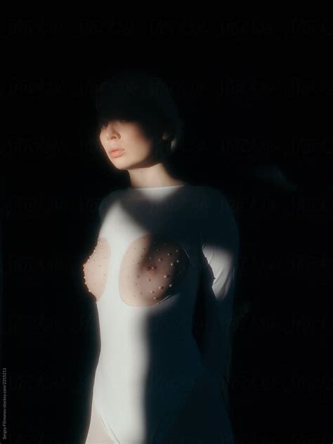 Sensual Female With Nude Breast In Dark Room By Stocksy Contributor