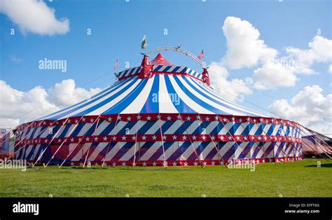 Uncle Sam's Great American Circus big top in a green field with a blue