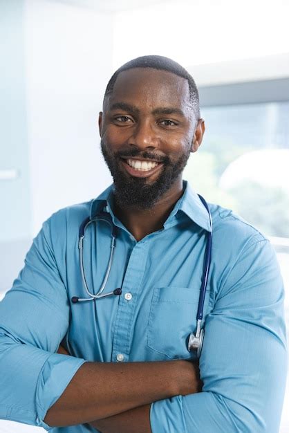 Premium Photo Portrait Of Happy African American Male Doctor Wearing