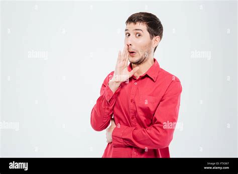 Man whispering gossip isolated on a white background Stock Photo - Alamy