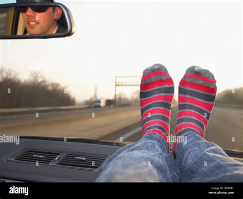 Feet on dashboard Stock Photo, Royalty Free Image: 17555217 - Alamy