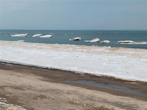 Shelf Ice Breaking Off Into Icebergs Along The Lake Michigan Beach At The Indiana Dunes Indiana