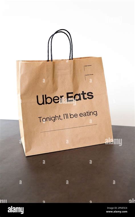 Uber Eats Paper Delivery Bag On Dining Table Stock Photo Alamy