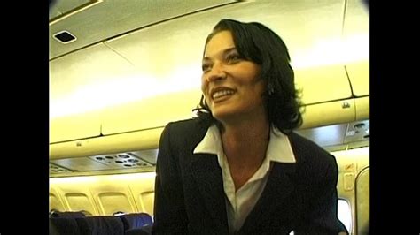 Brunette Beauty Wearing Stewardess Uniform Gets Fucked On A Plane