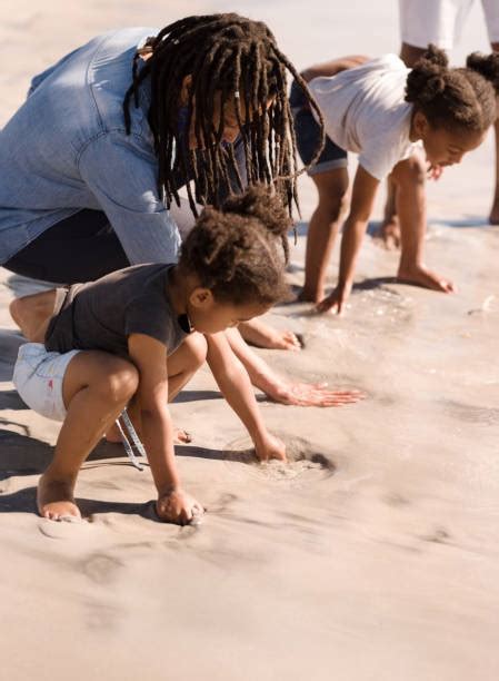 270+ Kids Digging Holes In The Sand Stock Photos, Pictures & Royalty ...