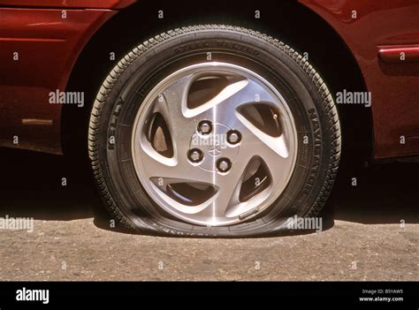 Flat Tire On Toyota Corolla Automobile Stock Photo Alamy