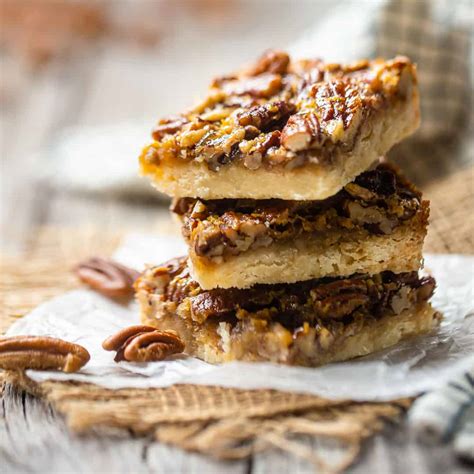 Pecan Pie Bars: Gooey, nutty filling over a buttery crust. -Baking a Moment