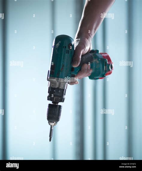 Close up of hand holding power drill Stock Photo - Alamy