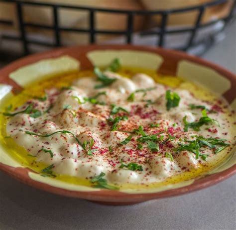 A Bowl Filled With Food Sitting On Top Of A Table