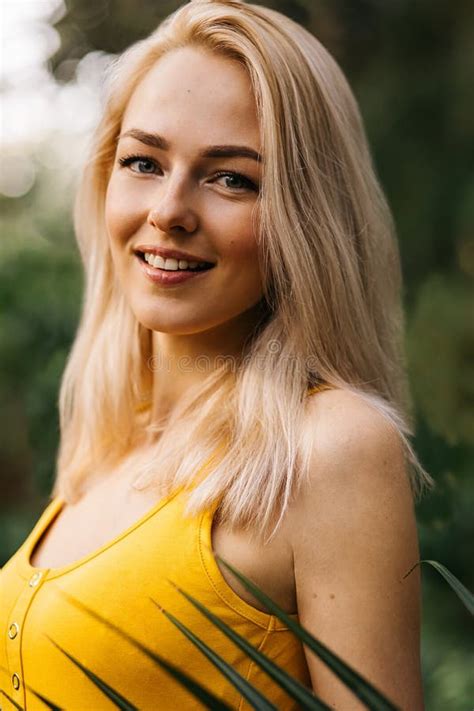 Close Up Vertical Portrait Of Happy Beautiful Luxurious Blonde With Cute Smile Standing Near