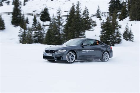 BMW M4 drifts in snow at BMW Driving Experience