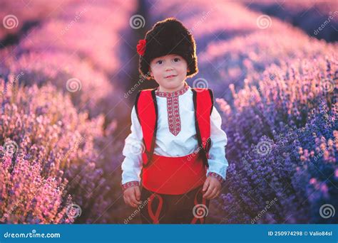 Baby Boy In Traditional Bulgarian Folklore Costume In Lavender Field