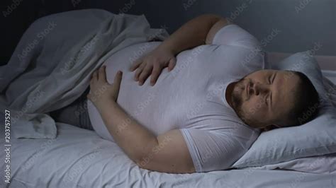 Fat Man Suffering From Stomach Pain At Night Health Problem Ulcer