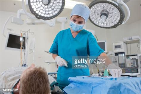 Usa Arizona Phoenix Surgeon Preparing Patient For Surgery High Res