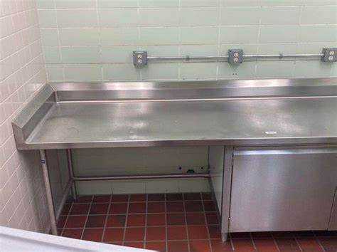 Stainless Steel Table with locking doors - McLaughlin Auctioneers, LLC- mc-bid.com