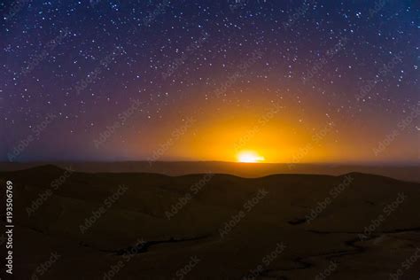 Night sky stars over desert hills sunset light. Stock Photo | Adobe Stock