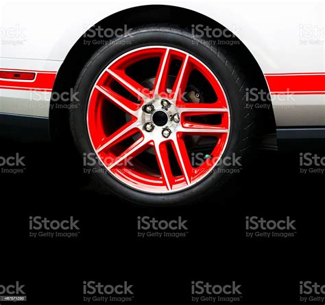 sport car red alloy wheel isolated  black background stock photo