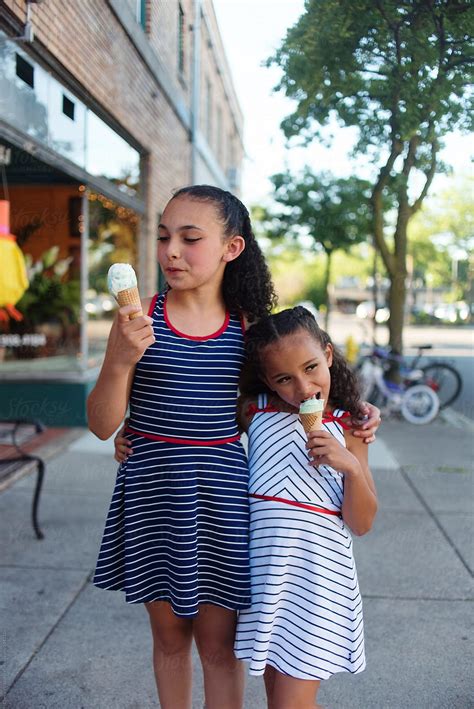 Young Sisters Eating Ice Cream By Stocksy Contributor Chelsea