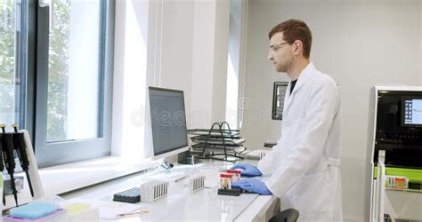 Man Laboratory Technician Working in Hospital with Modern Equipment Stock Footage - Video of ...