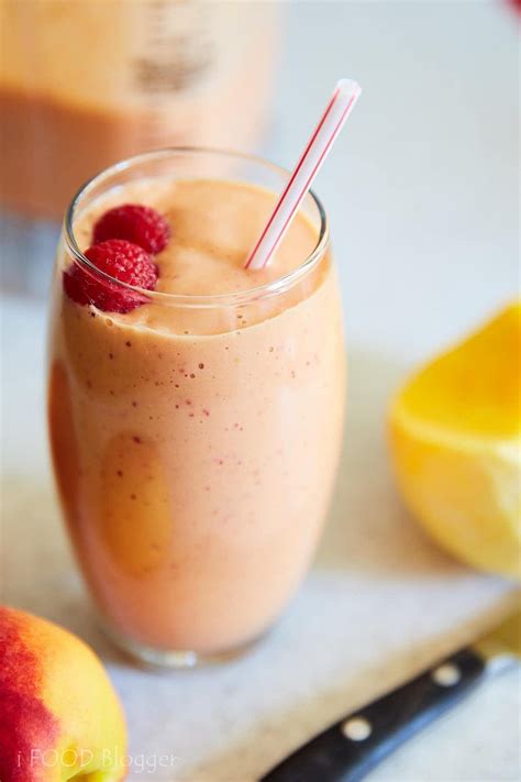 Delicious And Healthy Peach Smoothie With Raspberries And Mango