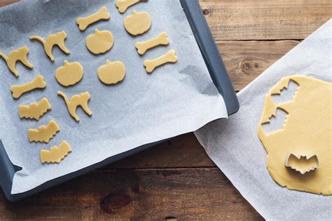 Premium Photo | Making cookies in different shapes for halloween ...