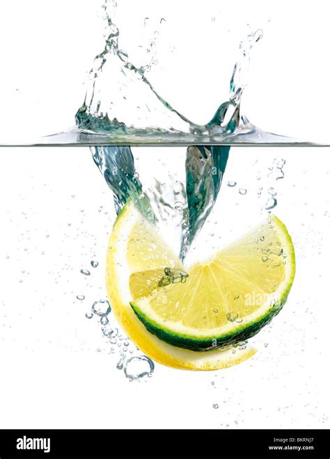 Slices Of Lemon And Lime Falling Into Water Creating A Splash Set