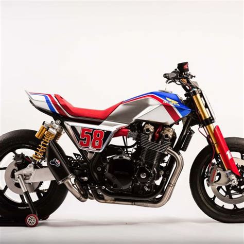 A Red White And Blue Motorcycle Parked In Front Of A White Background