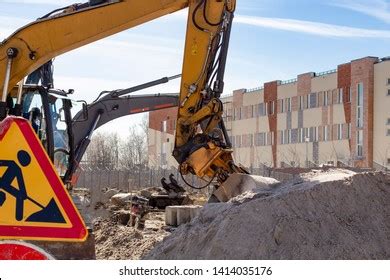 Yellow Excavator Digging Ground Construction Site Stock Photo