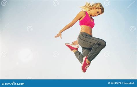 Portrait Of Jumping Fit Woman Stock Photo Image Of Blonde Fitness