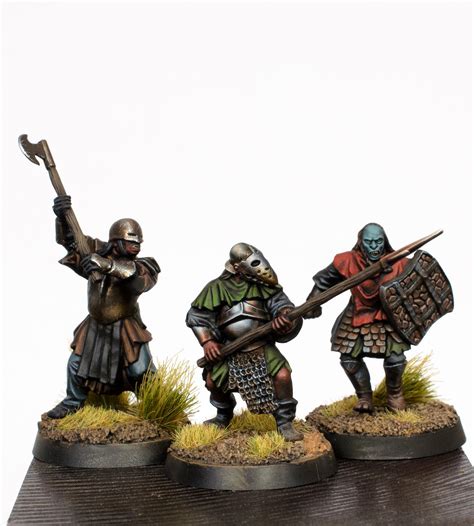 Three Mordor Orcs. The one on the left is painted with metallic paints and the rest with the NMM ...