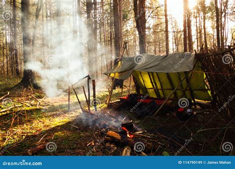 Smoky Campfire In Front Of Bushcraft Lean To Camp Stock Image Image