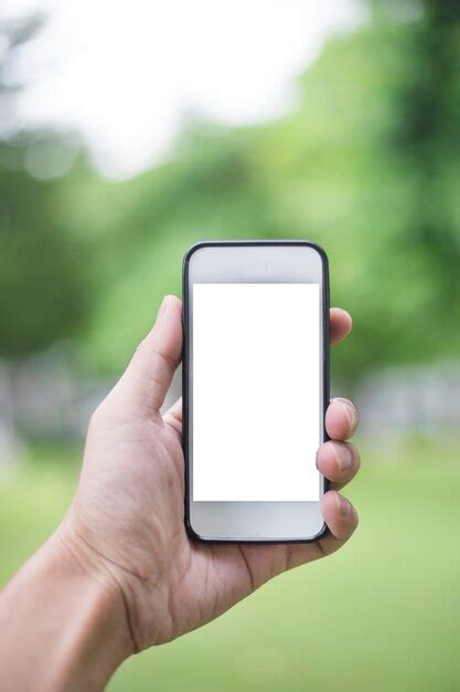 Premium Photo Close Up Man Hand Using Smartphone In Green Park