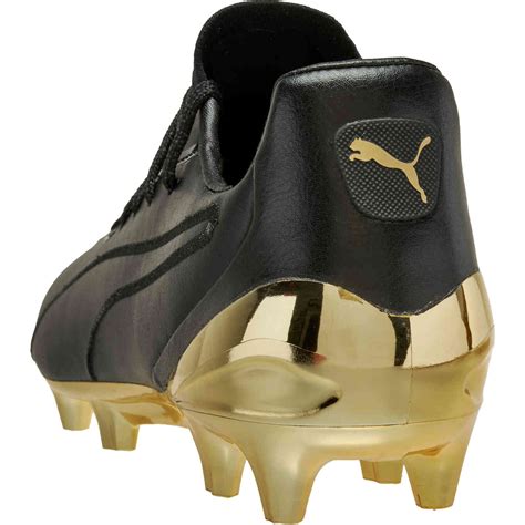 Puma King Platinum FG - Puma Black & Puma Team Gold - SoccerPro