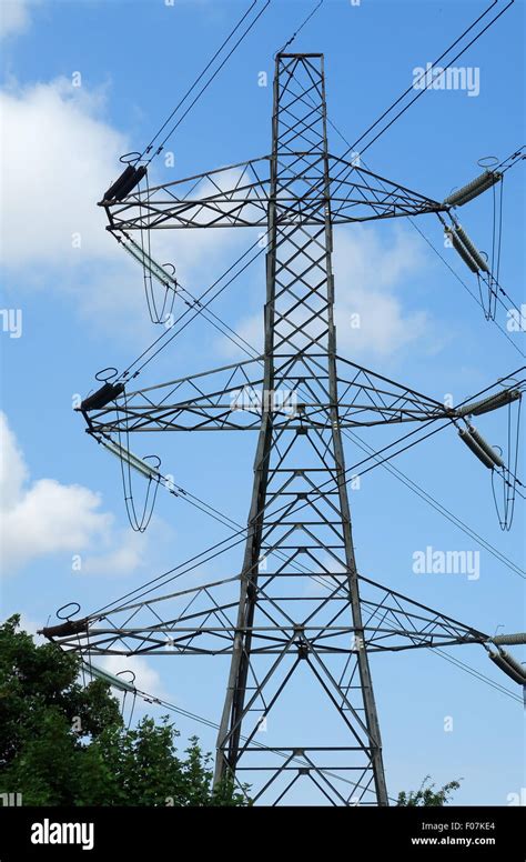 Electricity Pylon Showing The Cables And Connectors Set Against A Blue