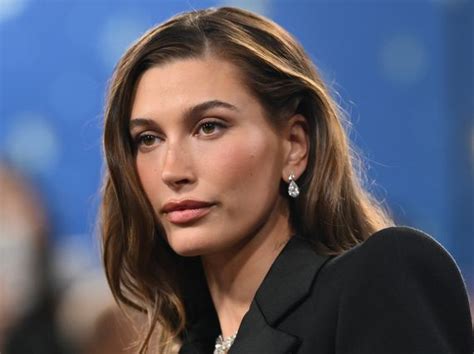 Hailey Bieber Poses Topless In Nothing But Hot Pants And Sunglasses