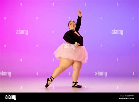 Inspired Beautiful Caucasian Plus Size Model Practicing Ballet Dance