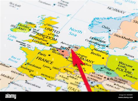 Red Arrow Pointing Netherlands On The Map Of Europe Continent Stock