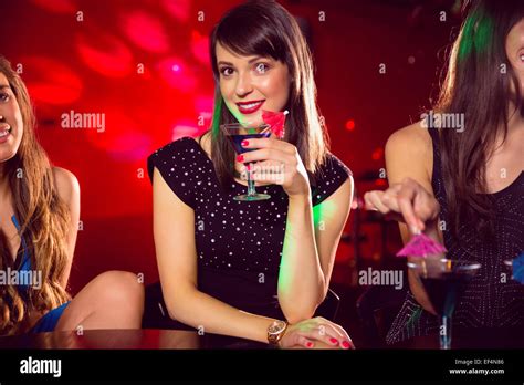 Pretty Brunette Drinking A Cocktail Stock Photo Alamy