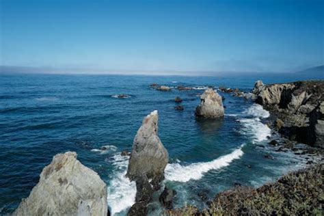 Rock Cliff Near Seashore · Free Stock Photo