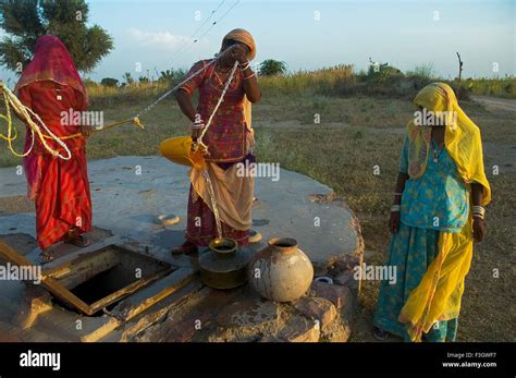 Women Filling Water From Well In Pots Village Nannadi Near Jodhpur