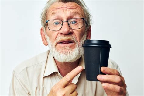 Premium Photo Portrait Of Young Man Drinking Glass Against White