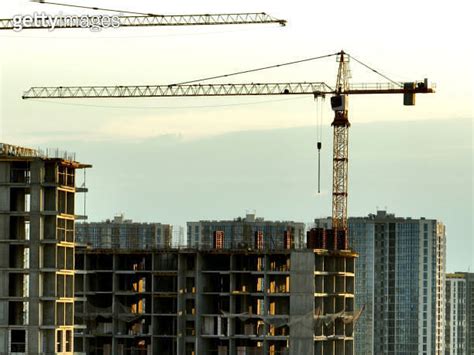 Construction Site With Tower Cranes On Building Construction