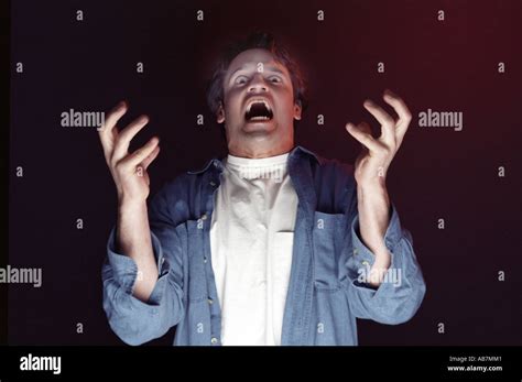 Screaming man yells fear and frustration concepts Stock Photo - Alamy